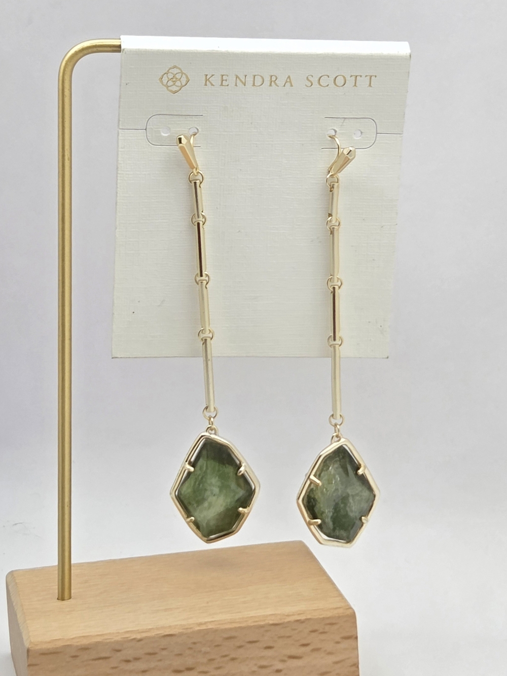 ​NWT Kendra Scott "Charmian" drop earrings featuring a faceted green stone drop